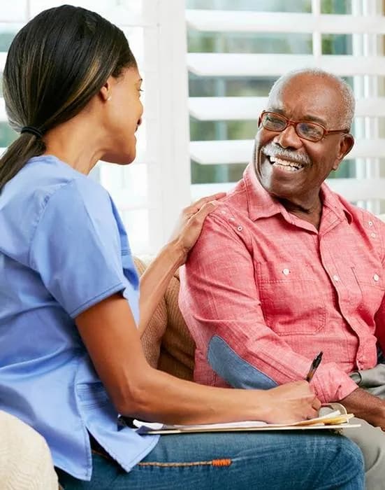 A Focus Family Care caregiver providing around-the-clock 24-hour home care to a senior