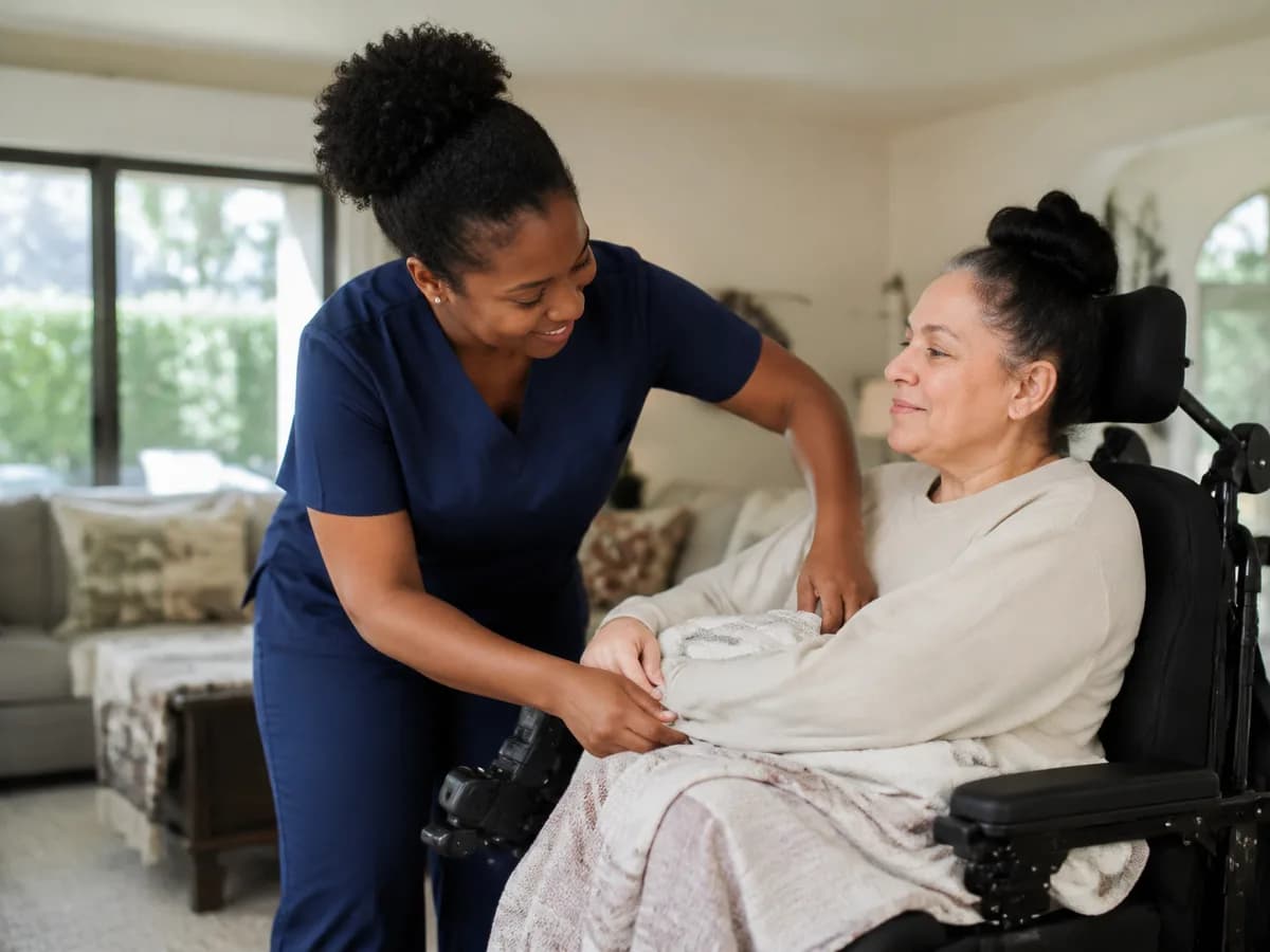 Focus Family Care nurse providing skilled home care to an adult quadriplegic patient in a wheelchair
